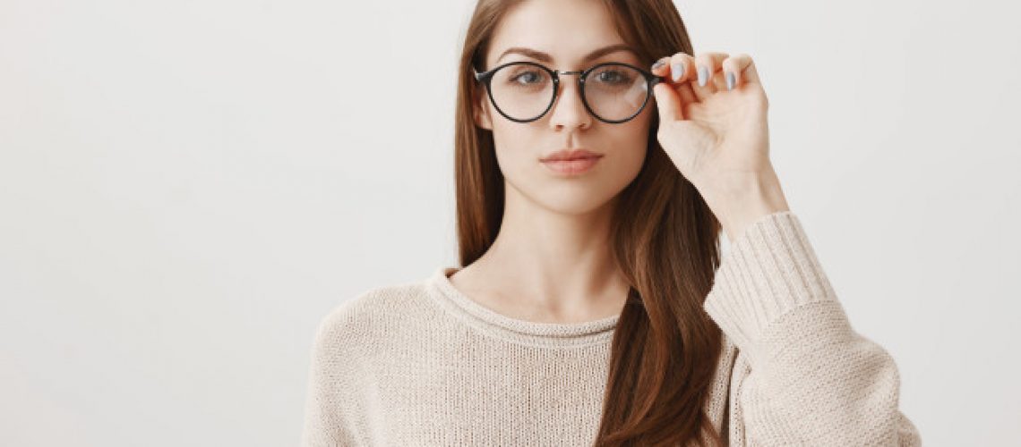 young-female-put-glasses-looking-determined_176420-20746